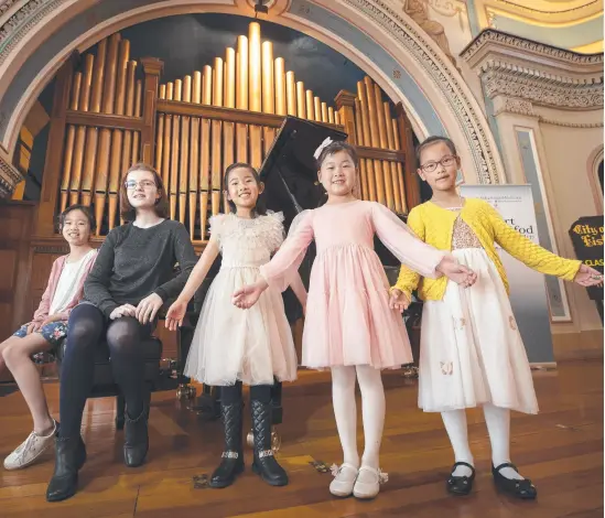  ?? Picture: Chris Kidd ?? Imogen Marr 10, Jacqueline Kus 13, Min Luo 7, Izzie He 7 and Chloe Zhao 8 prepare for the City of Hobart Eisteddfod.
