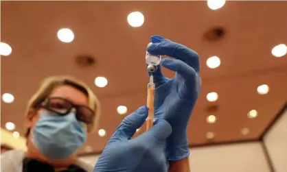  ??  ?? ‘While the face masks, hand washing and social distancing enable me to function in the present, the vaccine is my ticket to the future,’ writes Jon Lane. Photograph: Reuters