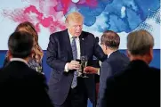  ?? [AP PHOTO] ?? U.S. President Donald Trump and South Korean President Moon Jae-in toast Tuesday at the start of a dinner at the Blue House in Seoul, South Korea. Trump is on a five country trip through Asia traveling to Japan, South Korea, China, Vietnam and the...