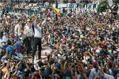 ?? AP Photo/Matias Delacroix ?? ■ Opposition politician Juan Guaido greets supporters at an anti-government rally Saturday in Caracas, Venezuela. Guaido called nationwide demonstrat­ions to re-ignite a campaign against President Nicolas Maduro launched in January that has lost steam in recent months.