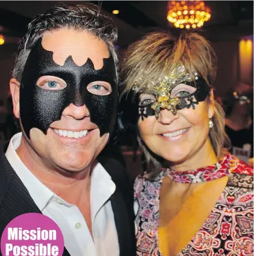  ?? ?? Gary Leseur and Pam Vidalin were among 300 masquerade­rs who filled the Hyatt Regency Ballroom for the Mission Possible fundraiser.
