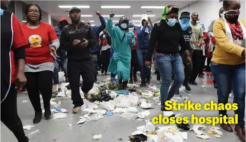  ?? Picture: Neil McCartney ?? Members of the National Health Education & Allied Workers Union march in the main corridor during a protest at Charlotte Maxeke Hospital in Johannesbu­rg, yesterday.