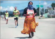  ?? JOSE LUIS GONZALEZ / REUTERS ?? An indigenous Tarahumara runner takes part in a half marathon along the streets in Guachochi, Mexico, on Sunday.