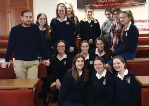  ??  ?? John O’Brien of Dominican College Wicklow with the thirteen students who raise funds.