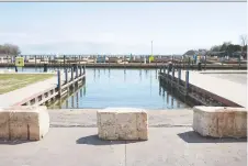  ?? DAX MELMER ?? Large barriers blocks were placed in front of the boat ramps at Lakeview Park Marina after more COVID-19 restrictio­ns were enacted by Premier Doug Ford on Saturday.