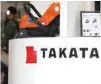  ?? — Reuters ?? The logo of Takata Corp is seen on its display at a showroom for vehicles in Tokyo, Japan.