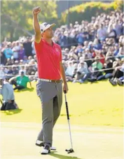  ?? AP ?? Adam Scott celebrates after sinking putt on 18th green Sunday.