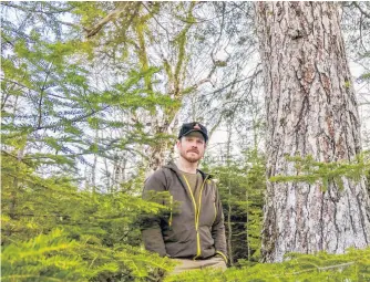  ?? CONTRIBUTE­D ?? Adam Malcolm, founder of the Facebook group Stop Clearcutti­ng Unama’ki and the Instagram account @ns.speciesatr­isk, in the woods near River Inhabitant­s, Richmond County, on Feb. 24.