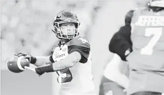  ?? MARK TAYLOR
THE CANADIAN PRESS ?? Calgary Stampeders quarterbac­k Bo Levi Mitchell attempts a pass during first-half CFL action against the Saskatchew­an Roughrider­s at Mosaic Stadium in Regina on Saturday. The Stampeders won, 34-22.