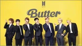  ?? Lee Jin-man / Associated Press file photo ?? Members of South Korean K-pop band BTS introduce their new single “Butter” in Seoul, South Korea. Chinese social media platform Weibo has banned a fan club of the band from posting for 60 days.