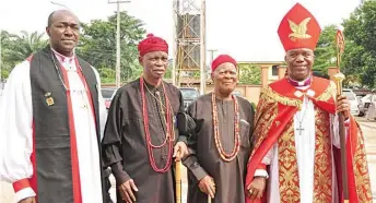  ?? ?? Rt. Rev. Ephraim Ikeakor ( right); Rt. Rev. Samuel Ezeofor of Aguata ( left) with traditiona­l rulers, Igwe K. Orizu of Nnewi and Col. J. O. C Onebunne of Akwaihedi ( second left) at the Synod Thanksgivi­ng Service at Saint Peter’s Anglican Church, Umudim, Amichi, Nnewi South Local Council of Anambra State