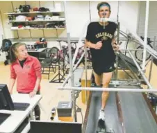  ?? Casey A. Cass, Provided by University of Colorado Boulder ?? Runner Andy Wacker tests a prototype shoe while being monitored by graduate student Shalaya Kipp for a study in the Locomotion Lab at the University of Colorado Boulder. The study found that the shoe, the Nike Vaporfly 4%, reduced the energetic cost of...