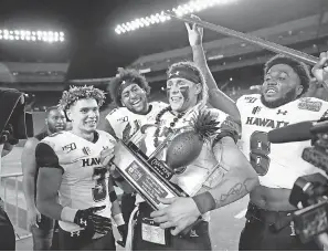  ?? MARCO GARCIA/ USA TODAY SPORTS ?? Hawaii celebrates after winning the 2019 Hawaii Bowl at Aloha Stadium against BYU.