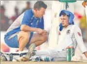  ?? GETTY IMAGES ?? Peter Handscomb is checked for heat exhaustion.