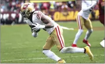  ?? DANIEL KUCIN JR. – AP ?? San Francisco 49ers cornerback Charvarius Ward (7) secures an intercepti­on during an NFL football game against the Washington Commanders on Dec. 31 in Landover, Md.