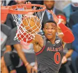  ?? JONATHAN BACHMAN/GETTY IMAGES ?? Oklahoma City’s Russell Westbrook dunks during the first half of the NBA All-Star Game.