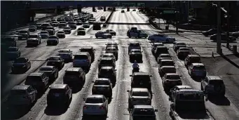  ?? Associated Press file photo ?? Cars wait at a red light on the Las Vegas Strip last year. The National Highway Traffic Safety Administra­tion has documented 11 more fatal wrecks involving automated driving systems.