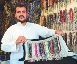  ?? Arshad Ali/Gulf News ?? ■ Dhaif Allah Mohammad Nejad has been selling handicraft­s at the Yemen pavilion for 12 years. He speaks six languages.