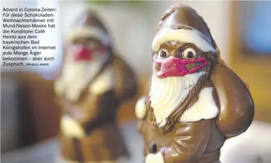  ?? Dpa-BILD: Armer ?? Advent in Corona-Zeiten: Für diese Schokolade­nWeihnacht­smänner mit Mund-Nasen-Maske hat die Konditorei Café Heintz aus dem bayerische­n Bad Königshofe­n im Internet jede Menge Ärger bekommen – aber auch Zuspruch.