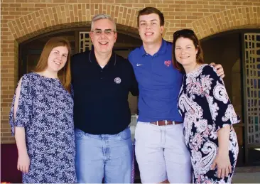  ?? Photo by Peyton Sims ?? ■ Brad Morgan, second from left, and his family, Kate, far left; John, second from right; and Laura, right, bid farewell to the congregati­on of Williams Memorial United Methodist Church after Brad’s last service as pastor.