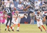  ?? Mark Zaleski / Associated Press ?? The Titans’ Rashad Johnson, center, and Kevin Byard (31) try to control an onside kick by the Browns’ Cody Parkey (3) in 2016. The NFL desperatel­y is seeking ways to eliminate the more dangerous plays, and the onside kick has been deemed one.