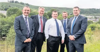  ??  ?? Council leader Andrew Morgan, centre, with Paul McMaster and Paul Brown of Sisk Group, and Nick Rolfe and Tim Whinney of Walters Group at the Cwm Cynon Industrial Estate, Mountain Ash
