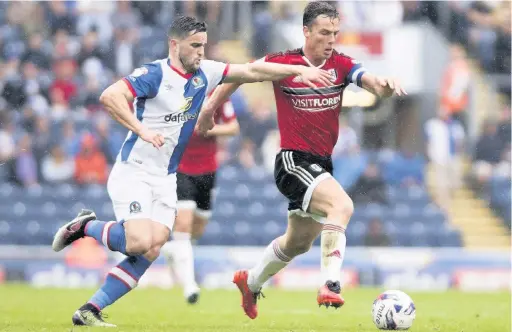  ??  ?? Craig Conway of Rovers tracks Fulham’s Scott Parker during the Sky Bet Championsh­ip match
