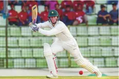  ??  ?? Zimbabwe’s Sean Williams drives one to the fence en route to his 88 during the first day of the first Test match.