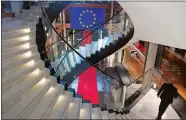  ?? JEAN-FRANCOIS BADIAS/AP FILE PHOTO ?? A man walks down stairs Dec. 12 during a special session on lobbying at the European Parliament in Strasbourg, eastern France.