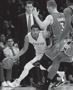  ?? LUIS SINCO/TRIBUNE NEWS SERVICE ?? The Los Angeles Lakers' Jordan Clarkson (6) tries to get around the defense of the Oklahoma City Thunder's Domantas Sabonis in the first quarter on Tuesday at Staples Center in Los Angeles.