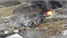  ?? AP photo ?? This photo taken with a drone shows portions of a Norfolk and Southern freight train that derailed Friday night in East Palestine, Ohio are still on fire at mid-day Saturday.