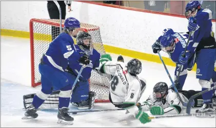  ?? JOE GIBBONS/THE TELEGRAM ?? Nova Scotia Gulls forward Cameron Macdonald (8) falls to the ice after he was upended during the opening game of the 2018 Atlantic AAA bantam hockey championsh­ip at Jack Byrne Arena in Torbay on Thursday afternoon. Zachary Dean (not shown) of the...