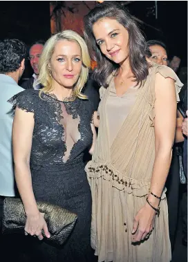  ??  ?? Peace and love Gillian Anderson, one of the stars of the BBC’s new version of War and
Peace, and fellow actress Katie Holmes were in West Hollywood for the launch of a book by fashion photograph­er Kelly Klein. Holmes has been seen sporting a diamond...