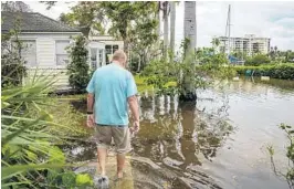  ?? RYAN VAN VELZER/STAFF ?? Ed Fitzgerald, 64, of Delray Beach, walks outside his home Thursday along Marine Way near the Intracoast­al Waterway.