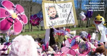  ??  ?? Wellwisher­s left flowers and toys near where the little girl’s body was found.