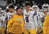  ?? JOSE CARLOS FAJARDO — STAFF PHOTOGRAPH­ER ?? Serra coach Patrick Walsh embraces Duncan Sutton (9) after a 45-0loss to St. John Bosco-bellflower in the CIF State Open Division final at Saddleback College on Saturday.