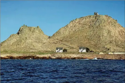  ?? FOR THE WASHINGTON POST BY ERIN E. WILLIAMS ?? The only human-inhabited island in the archipelag­o is Southeast Farallon Island, where two windblown dwellings house researcher­s. A lighthouse sits atop the island’s summit.