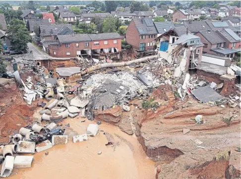  ??  ?? AFTERMATH: A whole row of houses which collapsed after subsidence at Erftstadt in North Rhine-westphalia.