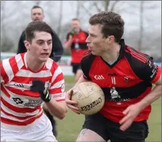 ??  ?? Niall Harney of Bannow-Ballymitty is faced by Niall Murphy.