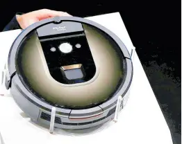  ?? AP ?? This file photo shows a Roomba 980 vacuum-cleaning robot presented during a presentati­on in Tokyo on Tuesday, September 29, 2015. Amazon on Monday called off its proposed acquisitio­n of iRobot, which was facing antitrust scrutiny on both sides of the Atlantic.