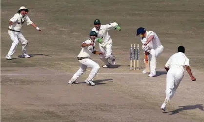  ??  ?? Andrew Flintoff is bowled by Danish Kaneria as Pakistan romp to victory in Lahore in 2005, the last time England played a Test in the country. Photograph: Mohsin Raza/Reuters