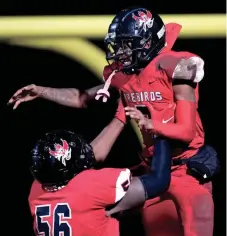  ?? ANDREW NELLES / THE TENNESSEAN ?? Pearl-cohn's Barion Brown (7) celebrates scoring a touchdown against Montgomery Central with Jadarious Lee (56) during the fourth quarter at Pearl-cohn High School in Nashville, Tenn., Thursday, Oct. 28, 2021.