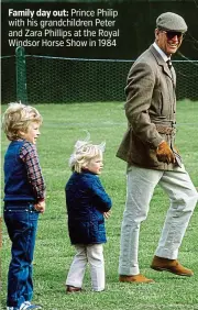  ??  ?? Family day out: Prince Philip with his grandchild­ren Peter and Zara Phillips at the Royal Windsor Horse Show in 1984