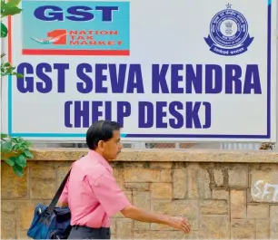  ?? — AFP ?? Currently, the goods and services tax is levied at 12 per cent with ITC on payments made for underconst­ruction property or ready-to-move-in flats.