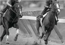  ?? BARBARA D. LIVINGSTON ?? Good Magic (right) breezes five furlongs in 1:00.76 on Friday ahead of the Grade 1 Travers Stakes next Saturday at Saratoga.