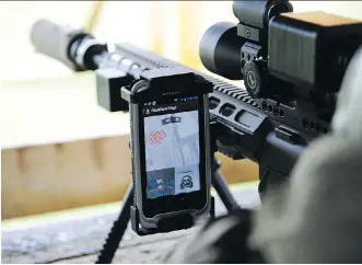  ?? DAVID PUGLIESE/ OTTAWA CITIZEN ?? General Dynamics Mission Systems Canada and Colt Canada have technology to link smartphone­s to weapons, and to existing military radio equipment.