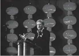  ?? CHRIS WATTIE/ REUTERS FILES ?? The prime minister speaks to a business audience in Guangzhou. Canada sees expansion to emerging markets as essential as traditiona­l investment and exports dries up.