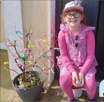  ??  ?? Mia-Lily Ruttle with her Corona Tree at home in Caim.