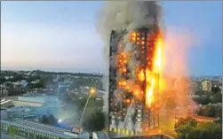  ??  ?? A fire engulfed the 24storey Grenfell Tower, housing more than 100 families, in west London on Wednesday, killing at least 12 people and injuring 74. The toll could rise.