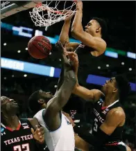  ?? AP/CHARLES KRUPA ?? Texas Tech’s Zhaire Smith dunks over Villanova’s Eric Paschall for his only two points in the Red Raiders’ 71-59 loss to Villanova on Sunday in the East Regional Final in Boston.